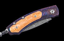 One of a Kind William Henry Custom Knife with Heat-blued 'Rolling Rock' damascus frame
