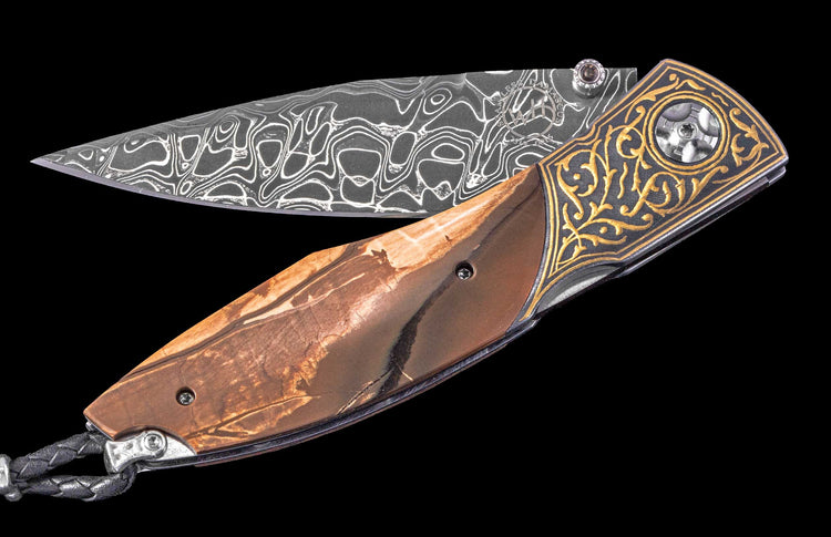 One of a Kind William Henry Custom Knife with 24K gold inlaid Koftgari frame, Fossil Woolly Mammoth tusk scales, Smoky Quartz gems, and damascus steel blade. 