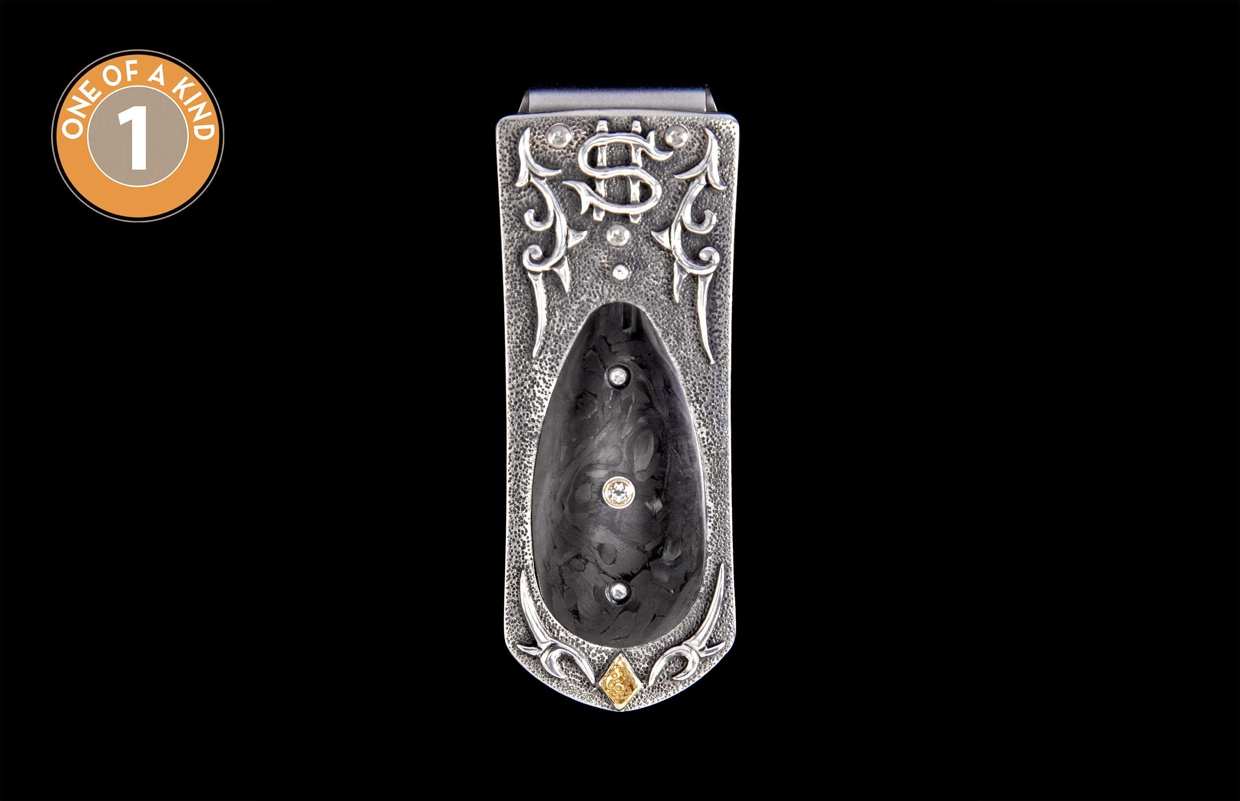 Ornate hammered silver money clip with a dark textured inlay, featuring three clear round diamonds and one square yellow diamond.