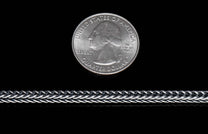 Silver jewelry chain with intricate braided links, shown horizontally with a US quarter dollar coin for scale.