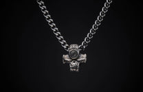 Silver-toned curb chain necklace with a detailed Norse-inspired hammer pendant.
