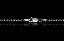 Silver ball chain with lobster clasp featuring WH logo and 925 stamp on a reflective black surface.