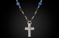Silver textured cross necklace with blue Sodalite and black lava beads.