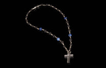 Blue sodalite and black lava stone beaded rosary with a textured silver-tone cross.