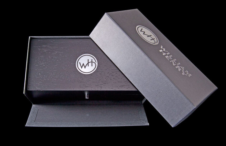 Beautiful wooden box that is custom fit to store or display your William Henry pocket knife. The box is stained a rich black and has silver hardware. A press of the single button opens the box on smooth hinges. It comes packaged within a quality outer box