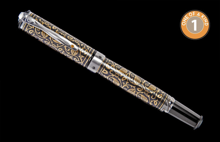 Elegant black and gold fountain pen with intricate golden scrollwork patterns and a silver-toned clip.