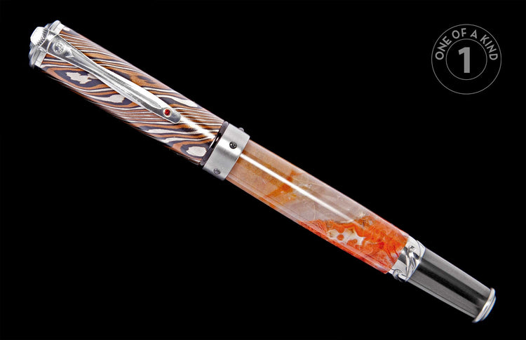 Fountain pen with a brown, white, and black striped cap and a translucent orange and white marbled barrel, featuring a silver clip with a red gemstone.