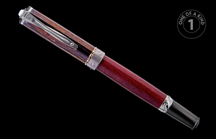 Brown and red wooden pen with a swirled cap and solid red barrel, featuring silver-tone accents, angled on black.