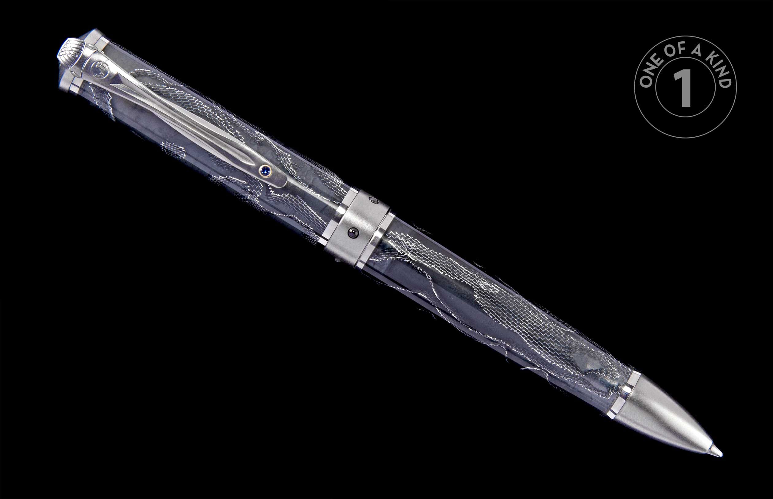 Elegant silver-toned pen with a transparent patterned barrel, featuring a decorative clip with a blue gem.