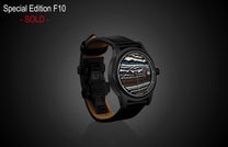 Special edition Fordite dial watch by William Henry, black case with multicolored layered pattern, black leather strap, side view