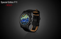 Special Edition Fordite watch by William Henry with vibrant marbled dial, black case, and leather strap, side view on dark background