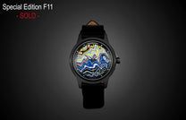 Fordite dial automatic watch by William Henry with vibrant marbled pattern, black case and leather strap, front view