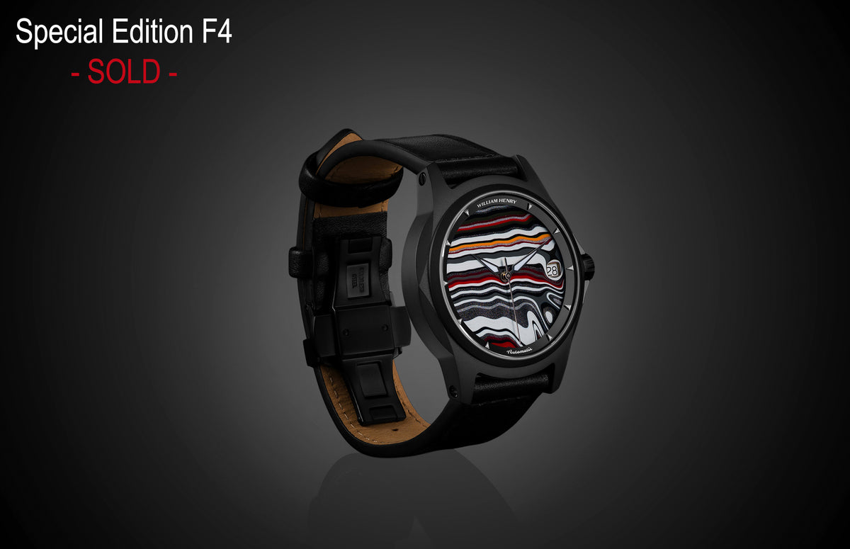 Special Edition Fordite watch by William Henry with marbled red, white, and black dial, black case, and leather strap, side view