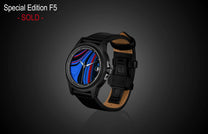 Special Edition Fordite watch by William Henry with blue and red marbled dial, black leather strap, and automatic movement, side view.