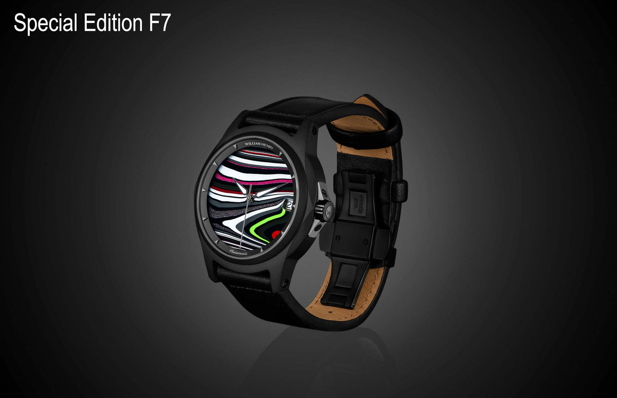 Special Edition Fordite watch by William Henry with multicolor striped dial, black case, and leather strap, side view on dark background