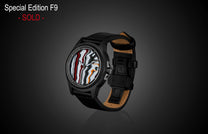 Special Edition Fordite watch by William Henry with marbled red, white, and black dial, black case, and leather strap, side view