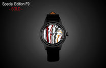 Special Edition Fordite watch by William Henry with multicolor marbled dial, black case, and leather strap, front view