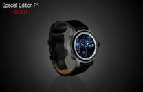 Pietersite dial automatic watch by William Henry with gray patterned case and black leather strap, side view on dark background