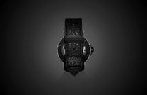 Special edition Pietersite watch by William Henry, featuring a black textured leather strap and striped bezel, back view on dark reflective surface