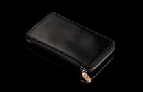 ZW LIZ BLK MT|Black textured leather large zipper wallet with a silver zipper and decorative wood-inlay pull, angled on a reflective surface.