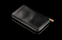 ZW LIZ BLK MT|Large black leather zipper wallet with embossed reptile texture and decorative patterned pull.